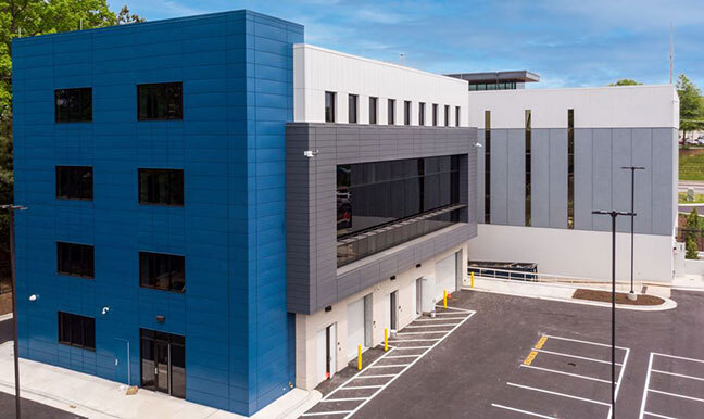 Guardian Roofing office building and trucks